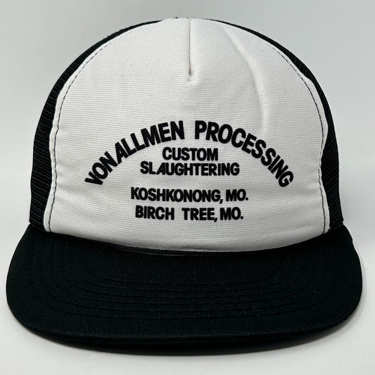 Front view of a Vintage Trucker Hat featuring a white and black design with custom logo text