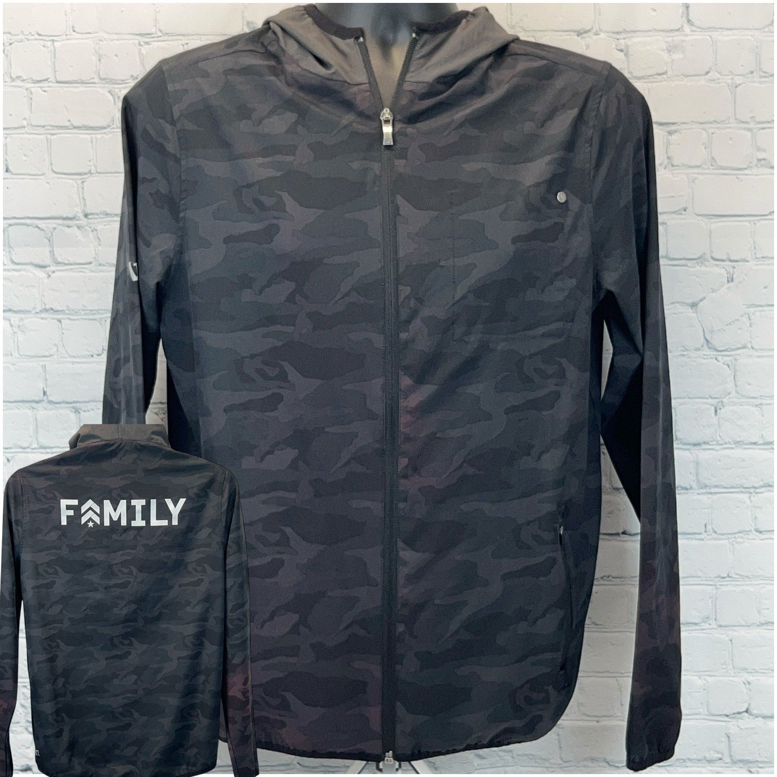 Vuori Jacket in black camo pattern, front view with logo on back, size medium
