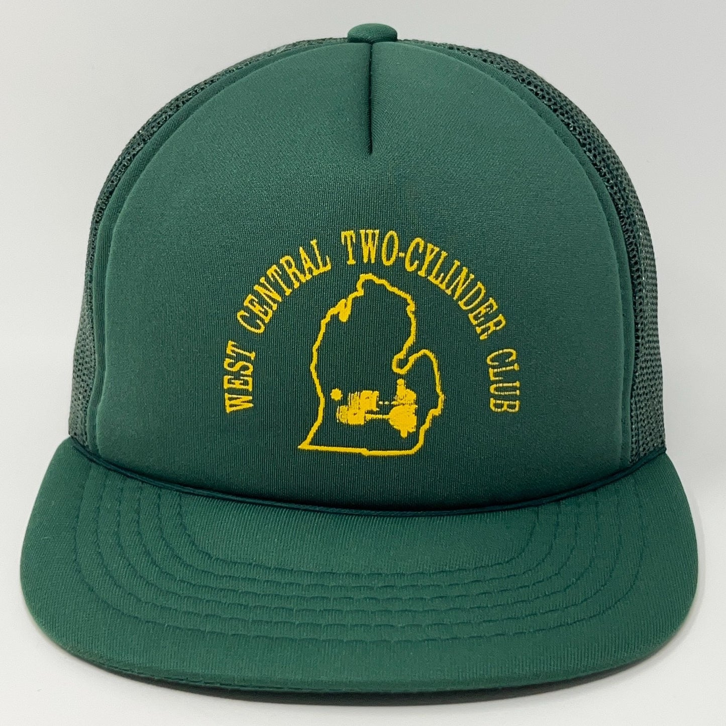 Front view of green cap featuring West Central Two Cylinder Club logo in yellow