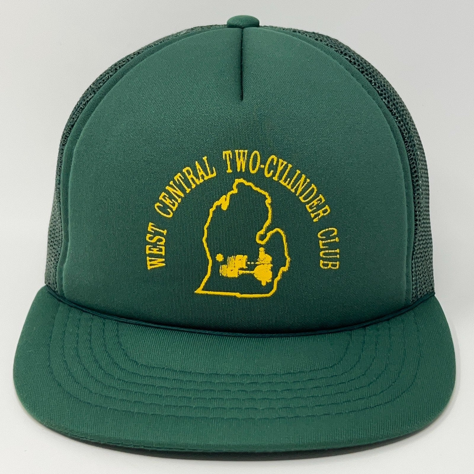 Front view of green cap featuring West Central Two Cylinder Club logo in yellow