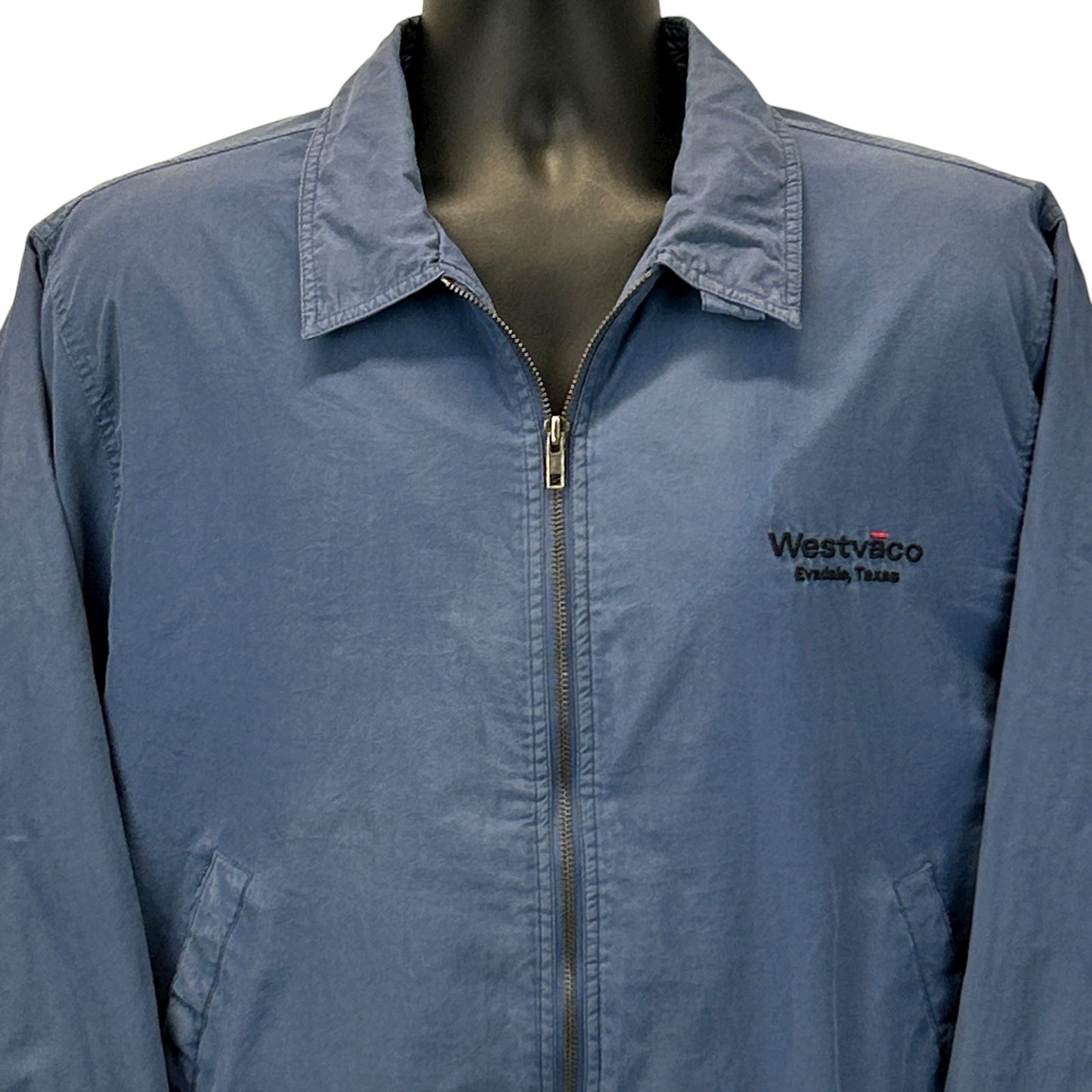 Blue Hartwell jacket with Westvaco logo, front view, featuring a zip closure and classic collar design