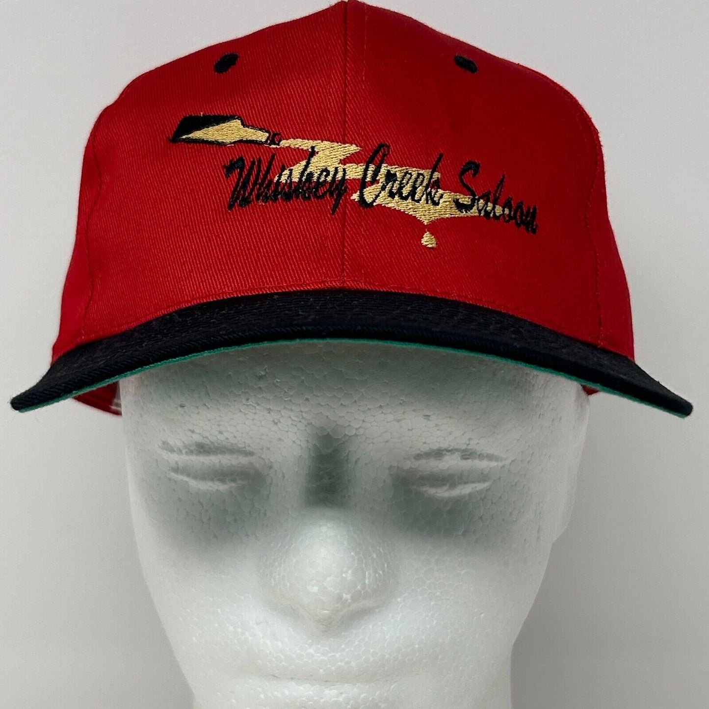 Red Vintage Whiskey Creek Saloon Hat with Black Bill and Embroidered Logo, Front View