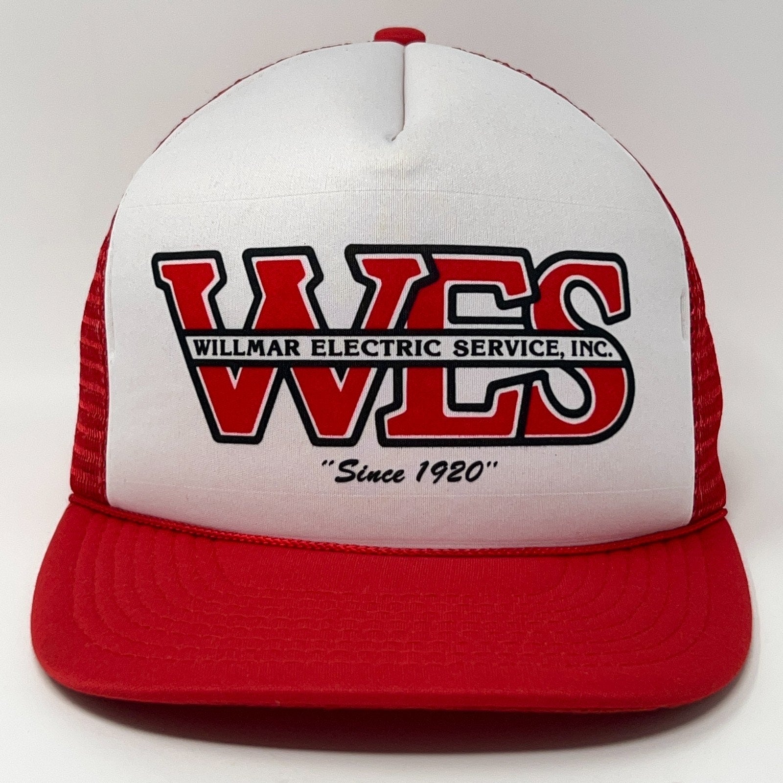 Red and white vintage trucker cap hat featuring WES logo and slogan since 1920 in front view