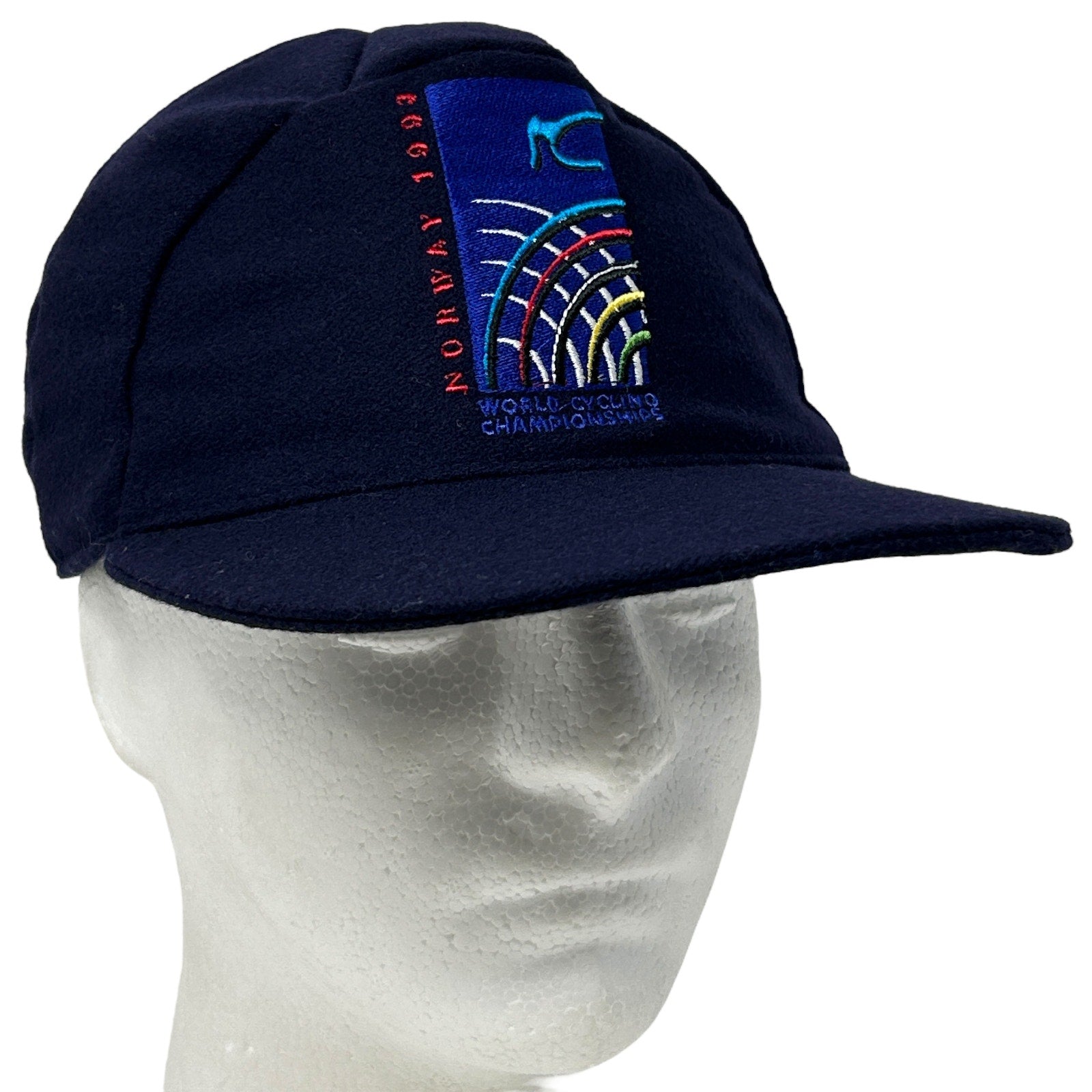 Vintage navy cycling hat with embroidered World Cycling Championships logo displayed at the front