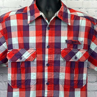 Front view of a World Industries Shirt in red, blue and purple plaid with pockets and logo detailing