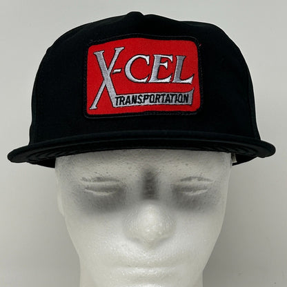 Front view of black DeLong hat featuring X-Cel Transportation logo in red and white for a bold look